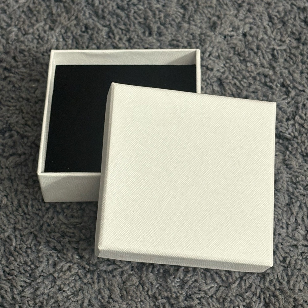 NWT white box with black puffy soft inside